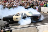 A car does a donut on the burnout pad at Summernats in Canberra.