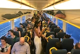 Passengers onboard an overcrowded morning peak V/Line train service from Geelong to Melbourne.