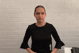 A gif of a woman using sign language.