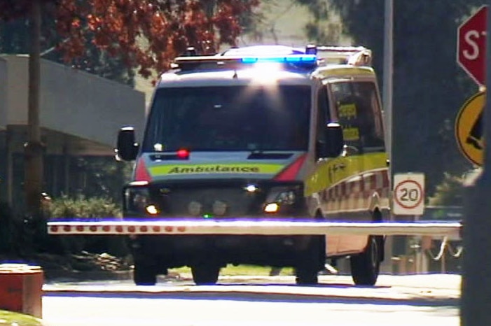 An ambulance leaves the Norske Skog paper mill.