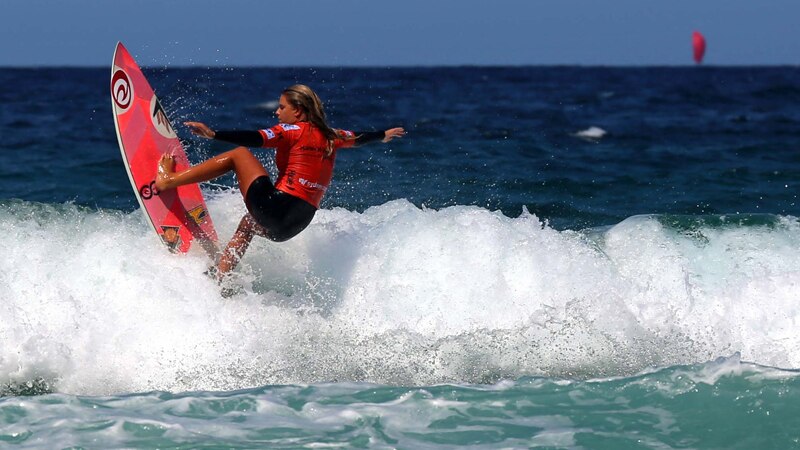 An athlete competes on day nine of the ASP Pro Junior Women surfing tournament at North Steyne, Manly Beach on February 8, 2014