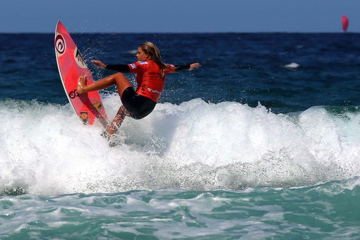An athlete competes on day nine of the ASP Pro Junior Women surfing tournament at North Steyne, Manly Beach on February 8, 2014