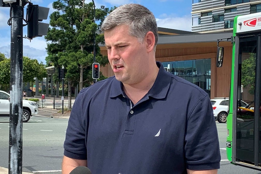 Mark Ryan at the side of a road at a press conference in Brisbane's north