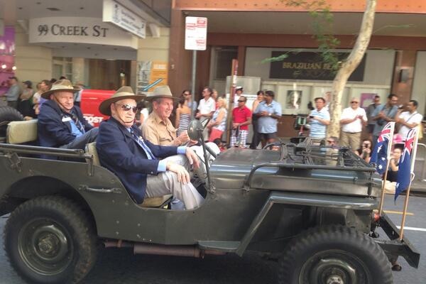 Veterans in a jeep take part in the Anzac Day march in Brisbane on April 25, 2014
