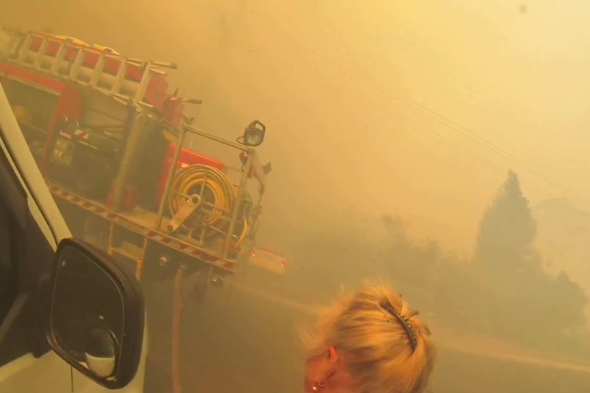 A women evacuating from the Mount Victoria blaze.