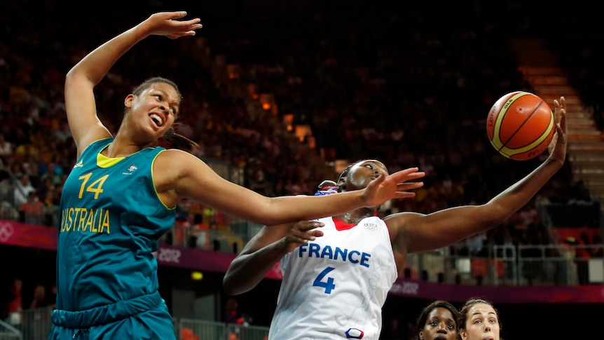 France's Isabelle Yacoubou (R) grabs rebound from Australia's Liz Cambage at London Olympics.