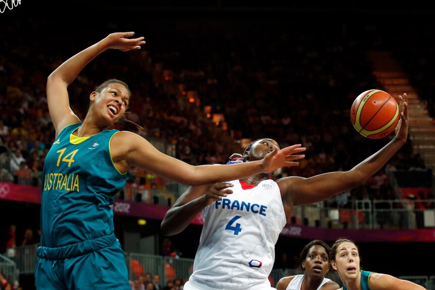 Liz Cambage battles with French centre Isabelle Yacoubou in the Opals loss.