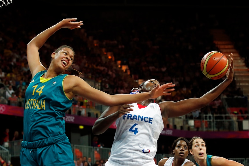 France's Isabelle Yacoubou (R) grabs the rebound from Australia's Liz Cambage.