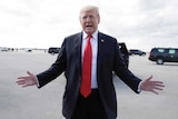 Donald Trump with his arms outstretched