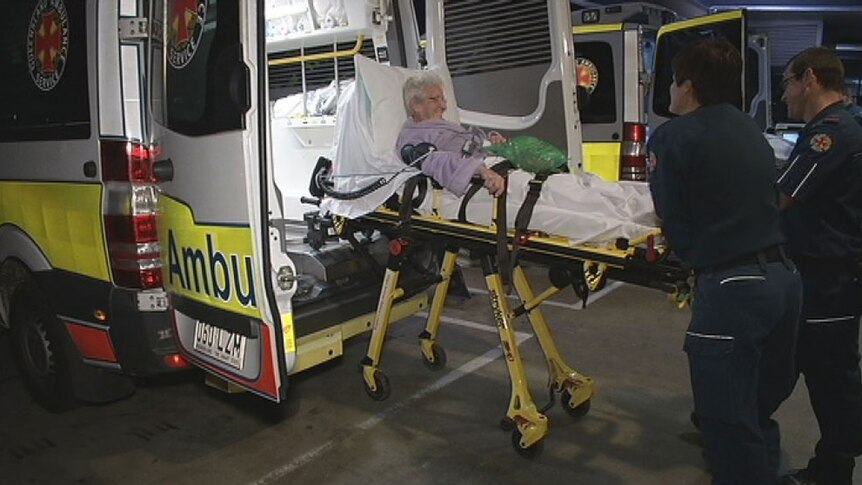 Patient being taken from ambulance at Logan Hospital, south of Brisbane in August 2013