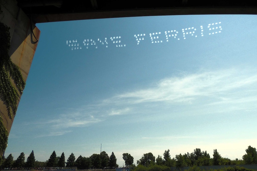 'Save Ferris' is written in the sky above Chicago.