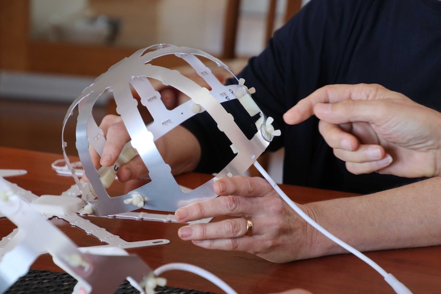 A light helmets which researchers hope could slow the progression of Parkinson's disease