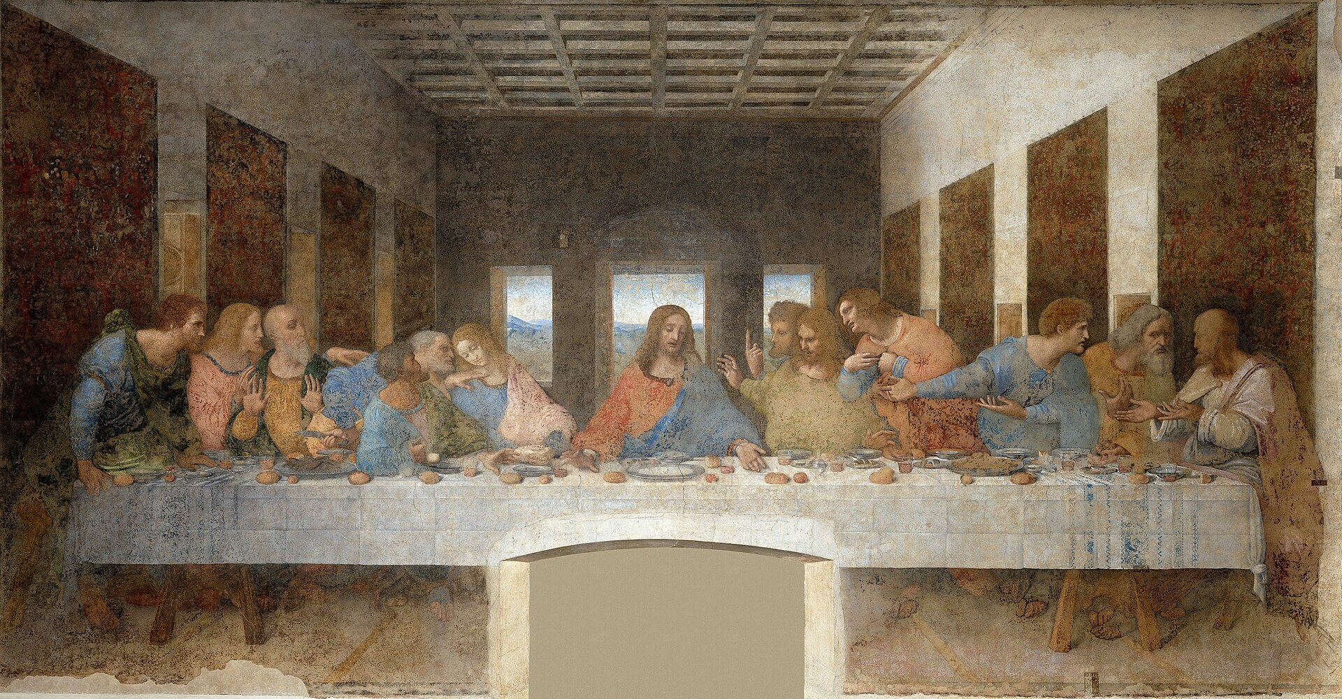 Un tableau du XVe siècle représentant 13 hommes en discussion animée assis le long d'un côté d'une longue table couverte de nourriture