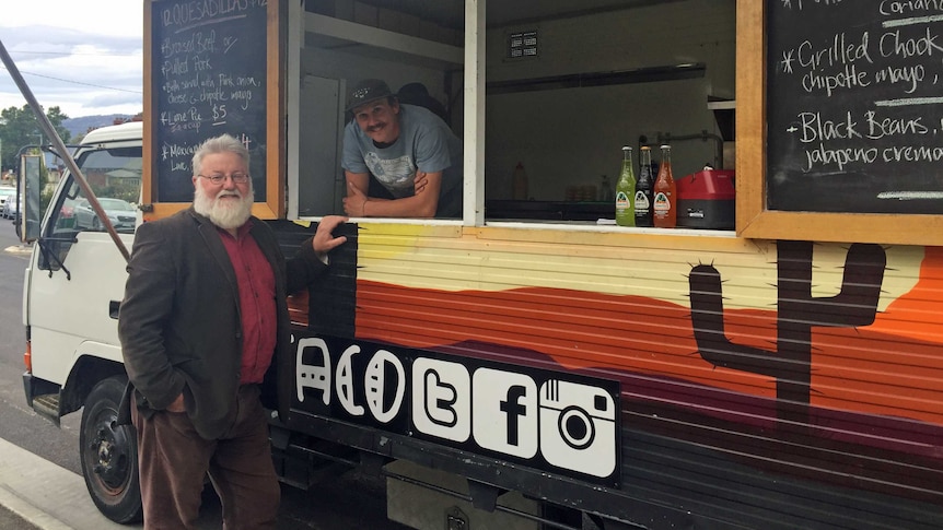 Alderman Bill Harvey standing next to food truck in Hobart