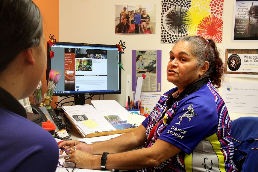 Sandra Anderson, community education counsellor at Bremer State High School in Ipswich, talks with an Indigenous student.