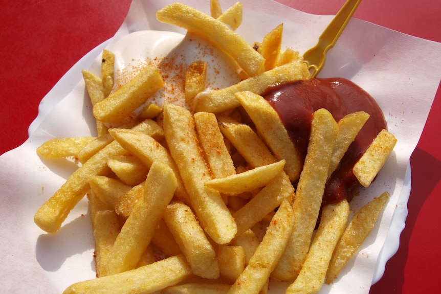 Hot chips with tomato sauce. 