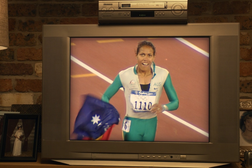 Older style TV with VHS player showing Cathy Freeman in the year 2000