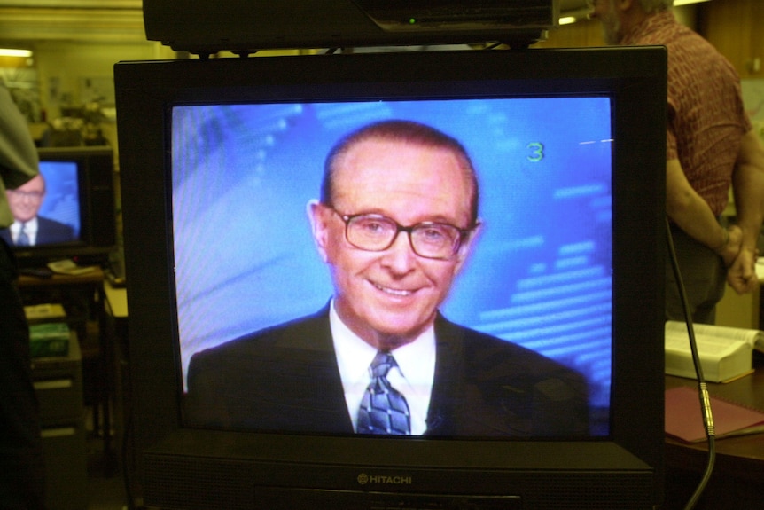 Brian Henderson reading the news on TV