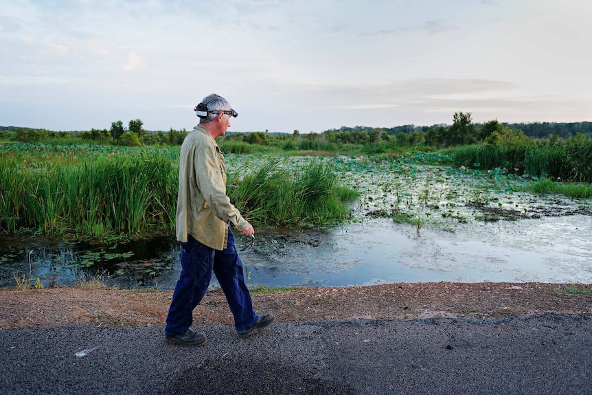 Dr Greg Brown walks at Fogg Dam.