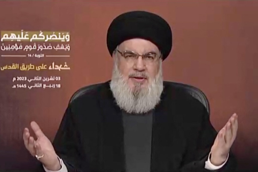 Arabic writing in top left where Hezbollah leader Sayyed Hassan Nasrallah delivers a speech. 