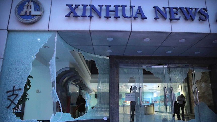 Windows smashed at the front of the Xinhua News Agency