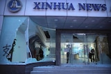 Windows smashed at the front of the Xinhua News Agency
