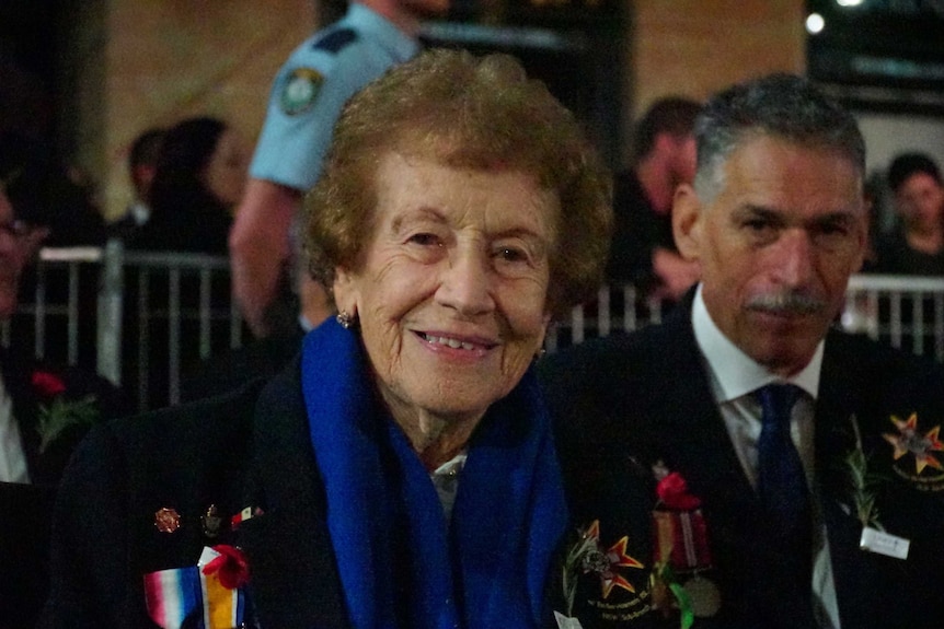 Lea harding smiles as she attends the Martin Place Dawn service