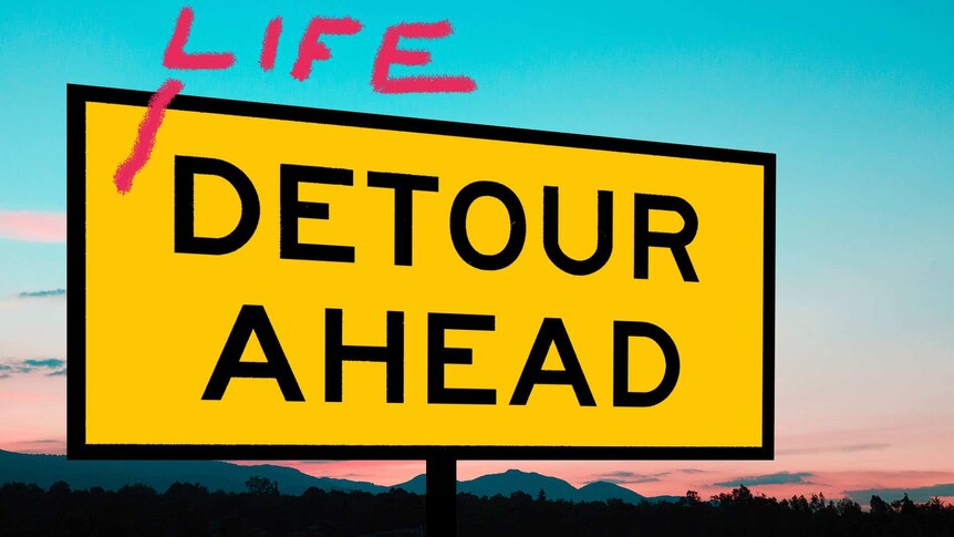 A 'detour ahead' road sign against a sunset horizon.
