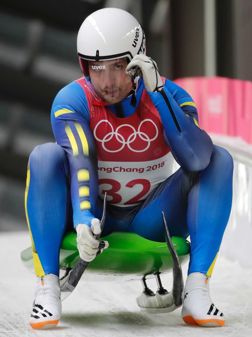 Andriy Mandziy looks on in the luge tunnel