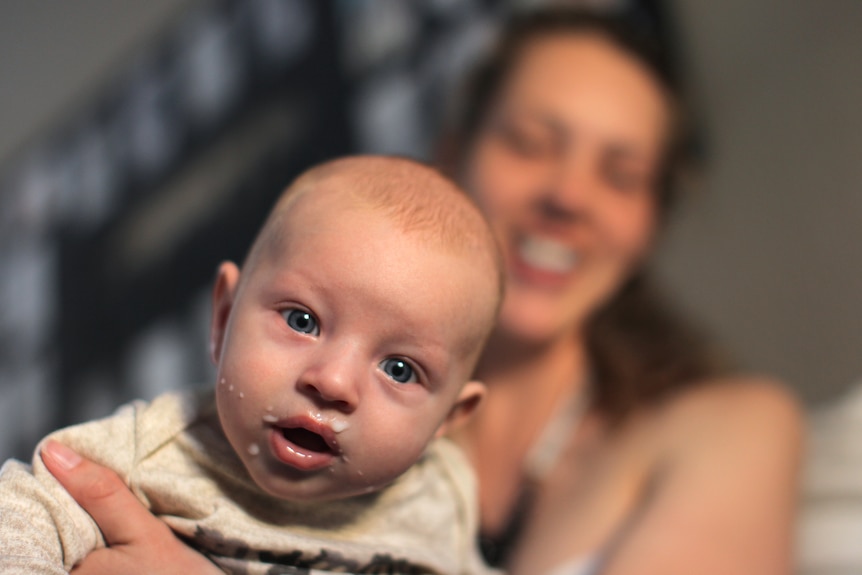 Baby with milk around its mouth