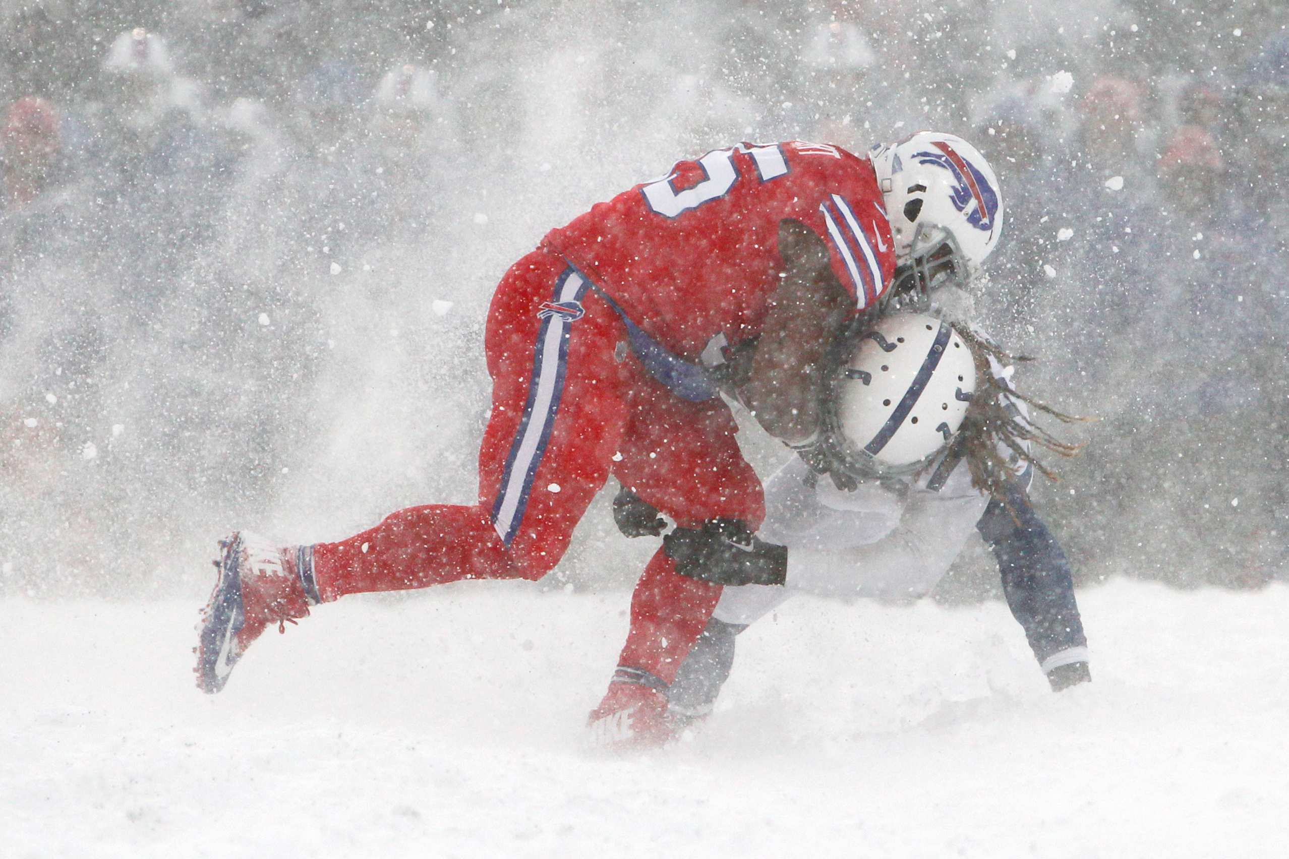 Snow covered Colts vs. Bills game action photos