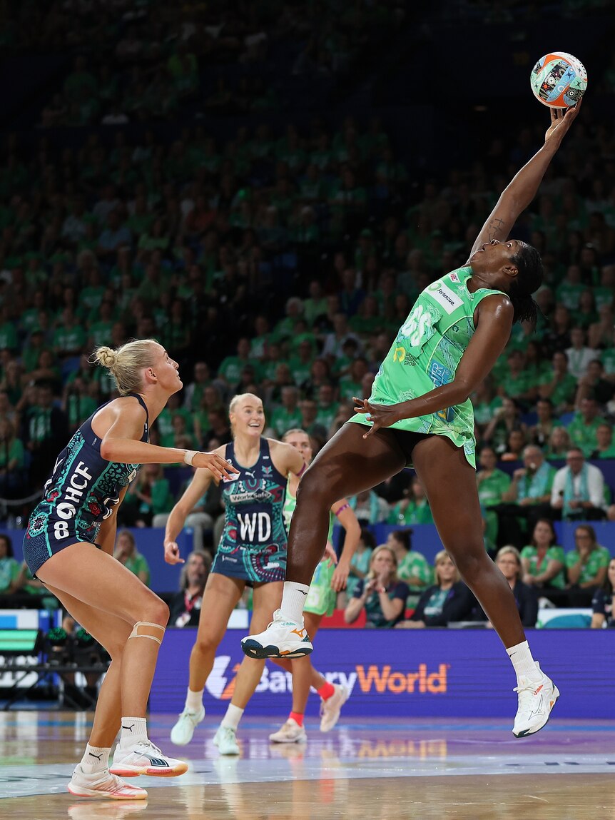 Jamaican shooter Fowler-Nembhard leaps and stretches high for a pass