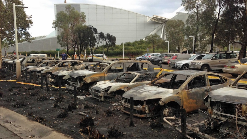The aftermath of a blaze that ripped through a Sydney Olympic Park car park