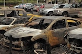 The aftermath of a blaze that ripped through a Sydney Olympic Park car park