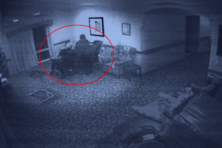 A low-resolution CCTV image shows Mulcahy sitting next to Mrs Jackson in his wheelchair.