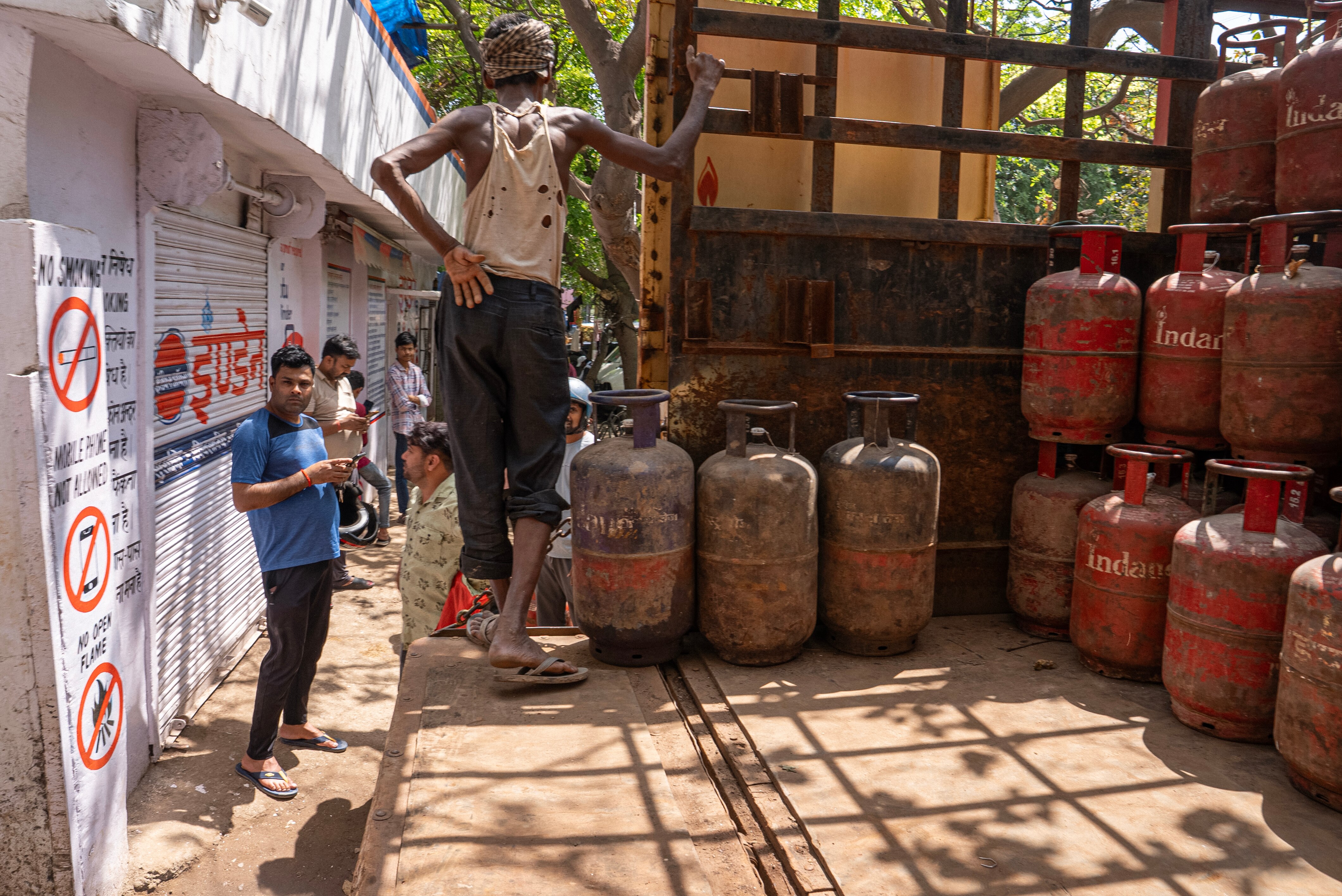 A group of cooking gas containers are stored in New Delhi.