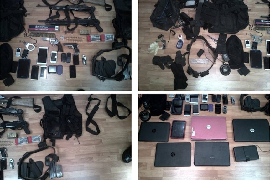 Stolen mobile phones, multiple other electronic equipment, guns, fake police jackets, a fake siren and handcuffs.