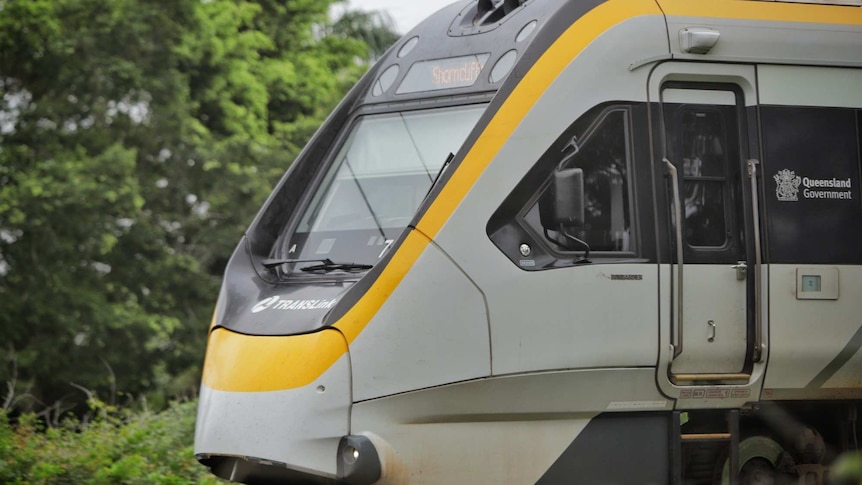 A close up of the front of an electric train