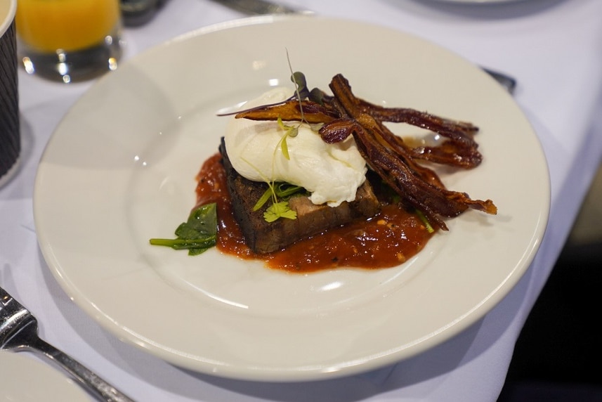 A plate of beef brisket with lamb bacon.