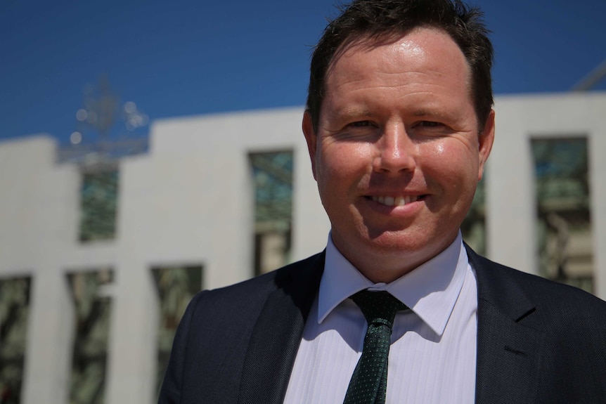 Nationals MP Andrew Broad stands out the front of Parliament House.