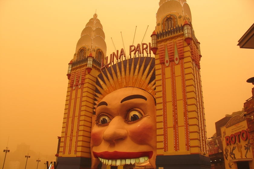 A dust cloud envelops Luna Park in Sydney on September 23, 2009.