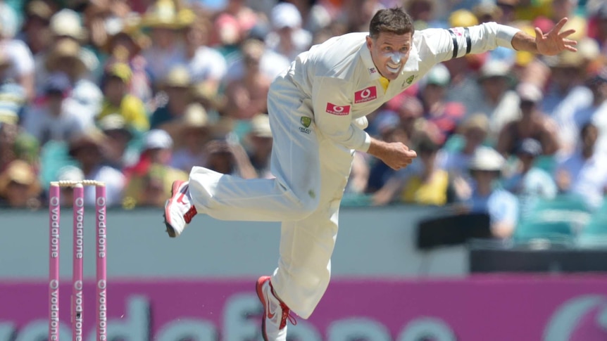 Hussey rolls the arm over