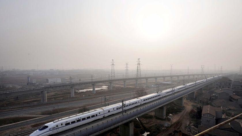 A high-speed train travels on the Wuhan-Guangzhou railway in Wuhan