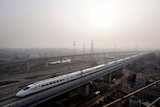 A high-speed train travels on the new Wuhan-Guangzhou railway in Wuhan