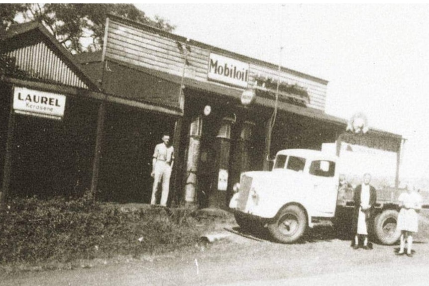 black and white pic of shop and truck