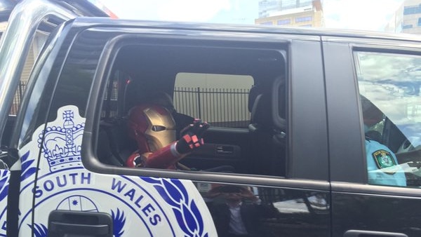 Iron Boy in police car
