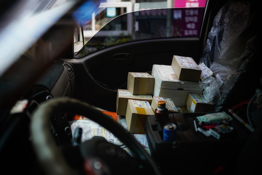 Boxes piled up on the front seat.