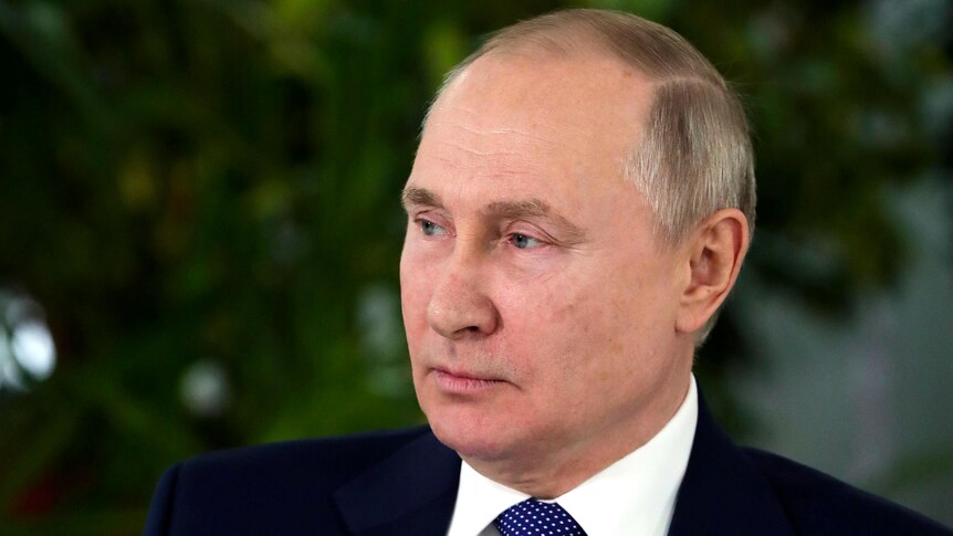 A 45 degree profile of the Russian president, looking straight faced