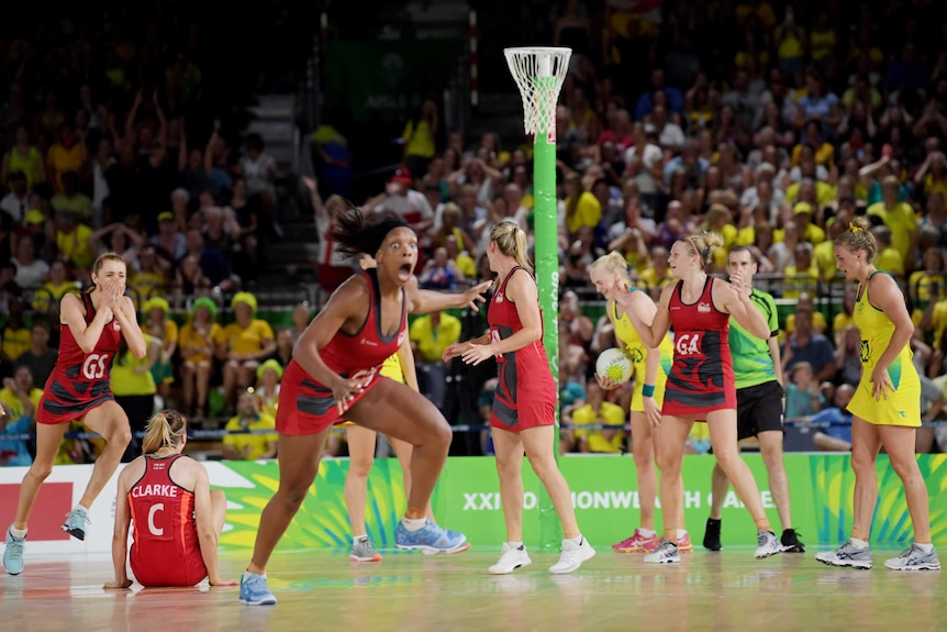 England's netballers celebrate their gold medal game win over Australia