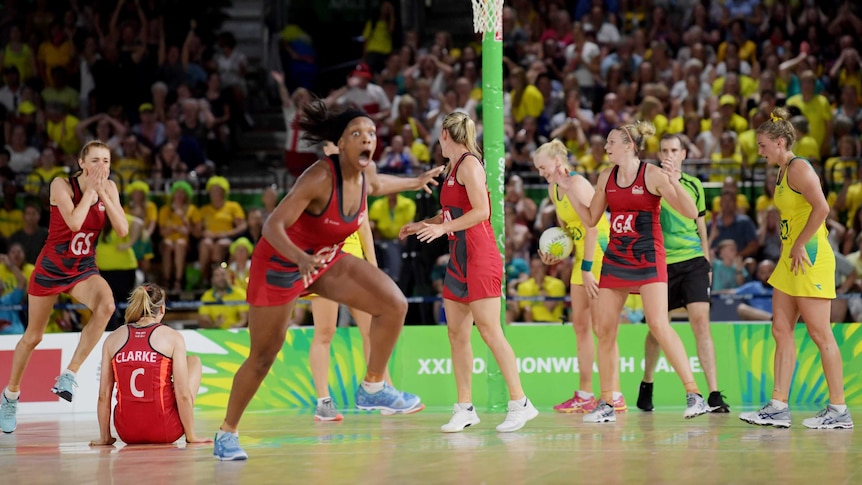 England celebrates at full time after winning the netball gold medal match against Australia.